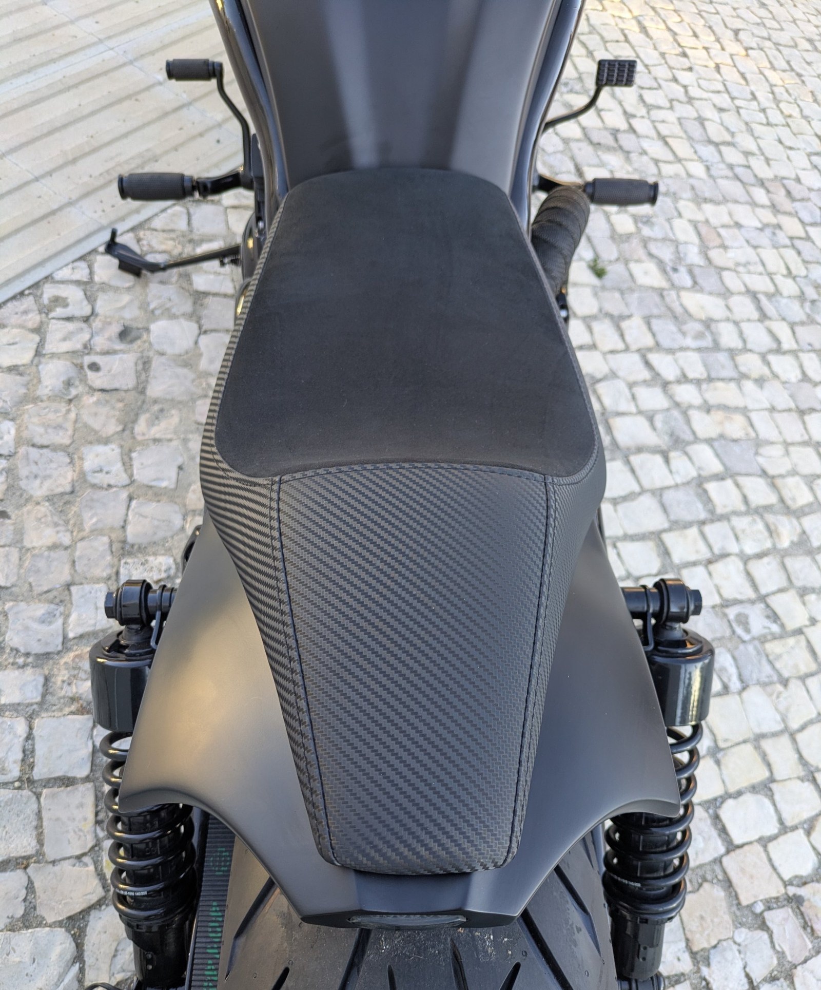 Seat re-upholstered in Alcantara with carbon-pattern leather sides