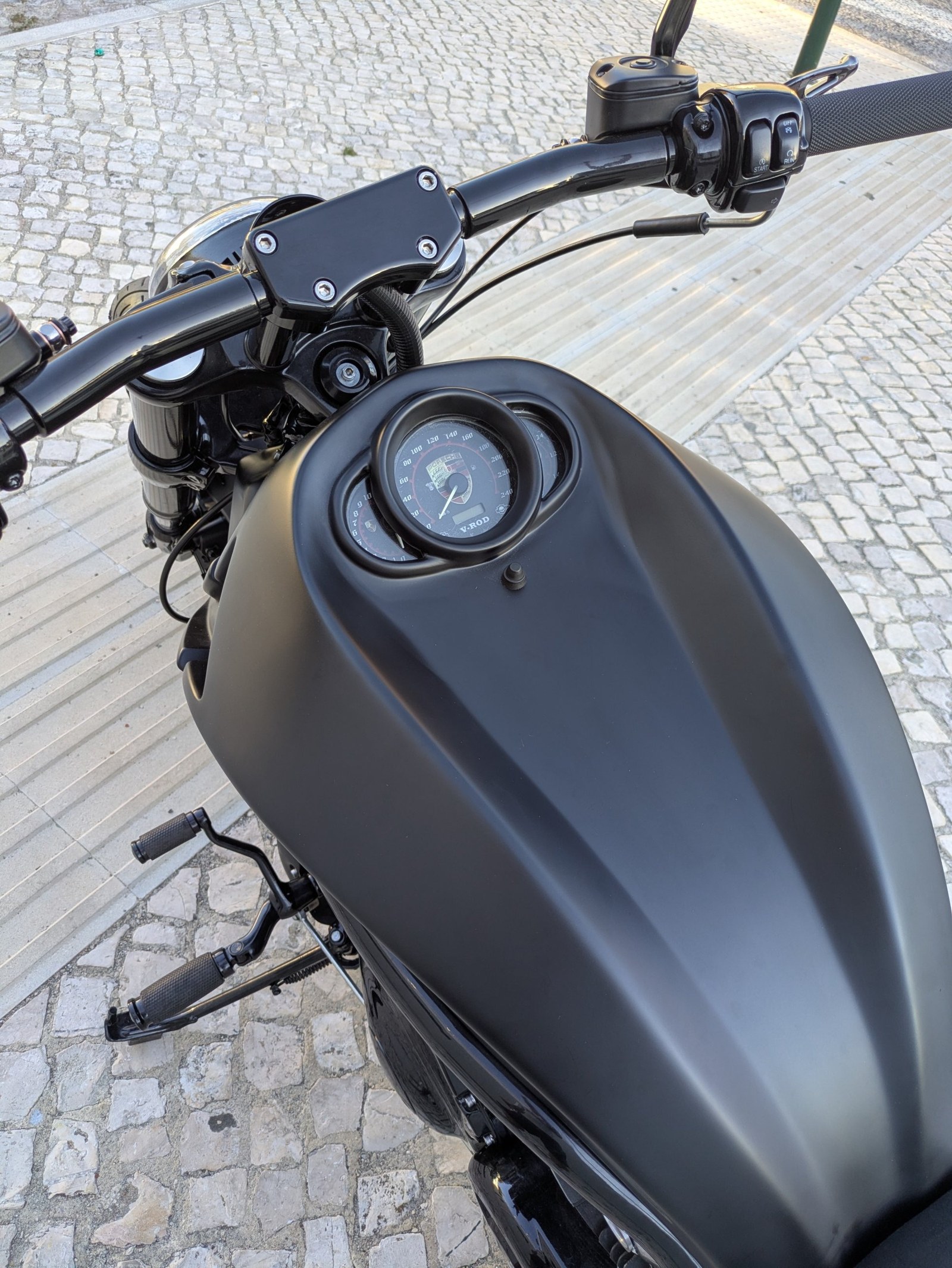 Matte black airbox cover, V-Rod gauges and taller handlebar risers