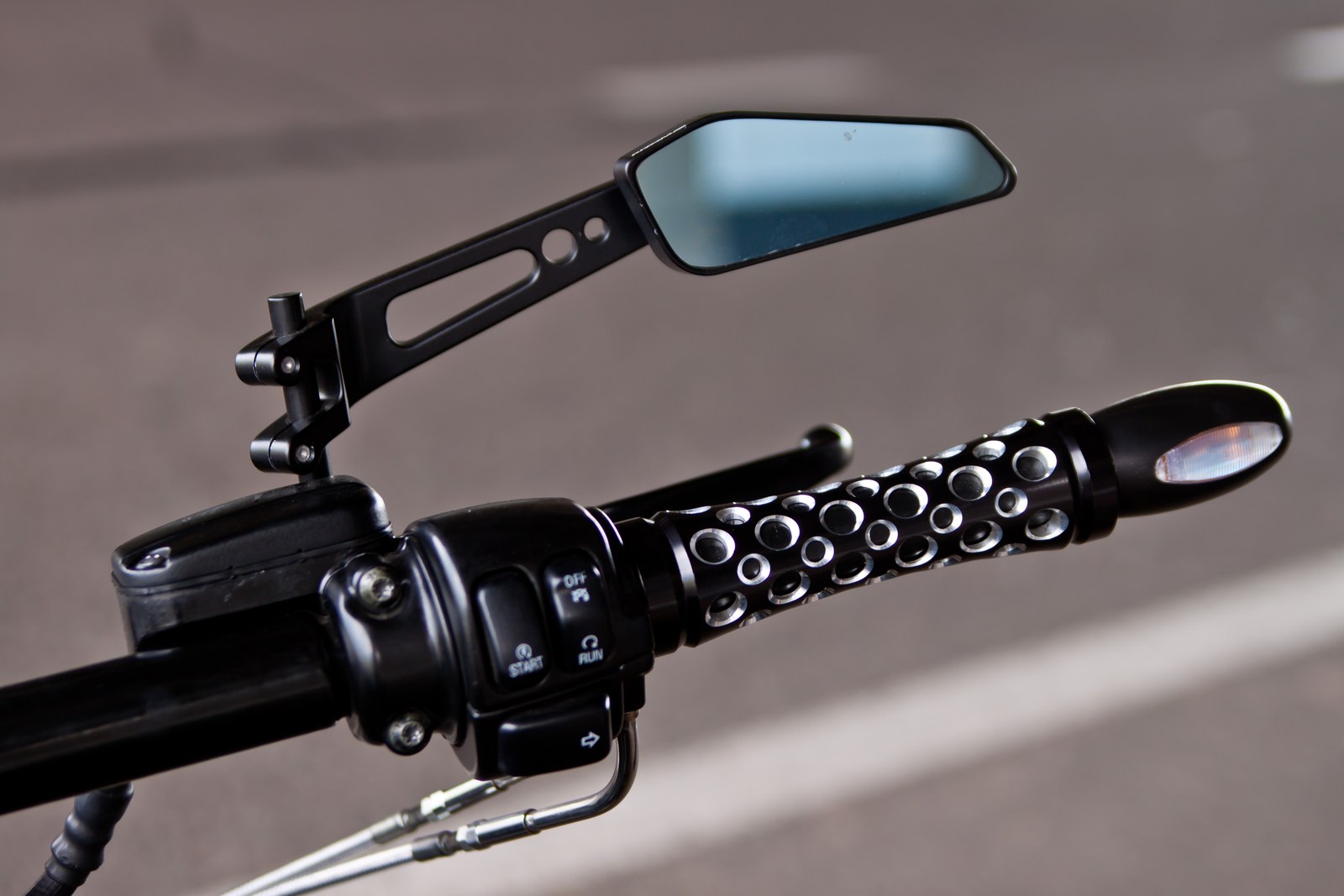 The First perforated handlebar grip and mirror detail