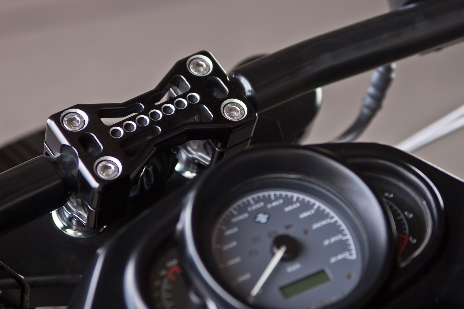 The First handlebar clamp and instrument cluster detail