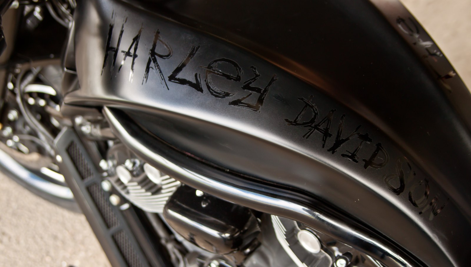 The First custom fuel tank and Harley-Davidson lettering detail