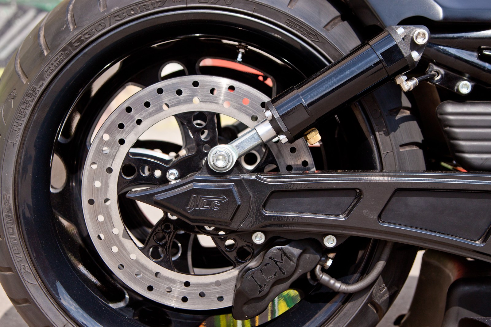 The First rear wheel, brake disc and NLC swingarm detail